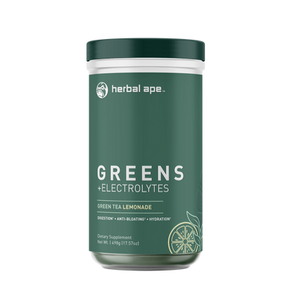 "Front view of a Herbal Ape Greens + Electrolytes container with a dark green label. The flavor is Green Tea Lemonade, and the label highlights benefits including digestion, anti-bloating, and hydration. A line art illustration of sliced lemon is visible at the bottom right.